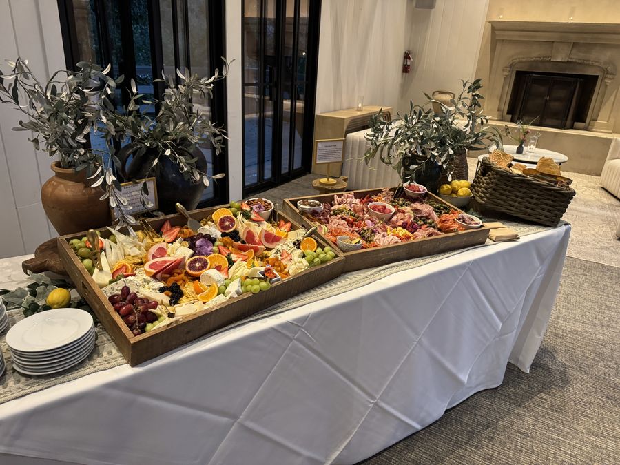 Cheese and fruit grazing boards with olive branch styling