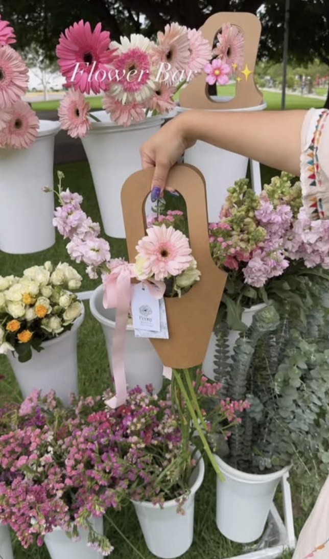 Inspiration: a flower bar with white buckets and a kraft bouquet carrier