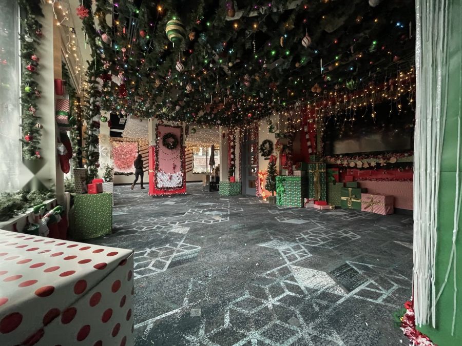 Holiday hallway with a ceiling of garland, ornaments and lights