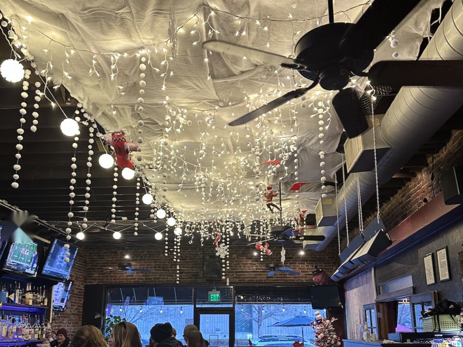 Winter wonderland ceiling of snow and lights over a neighborhood bar